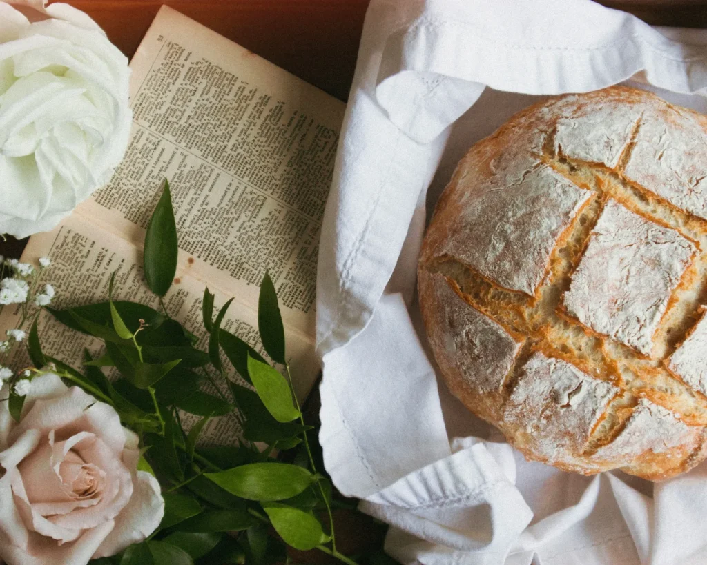 bread photshot with book and plant on wooden table