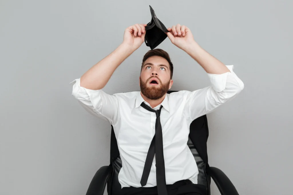 frustrated-surprised-bearded-man-white-shirt-showing-empty-wallet