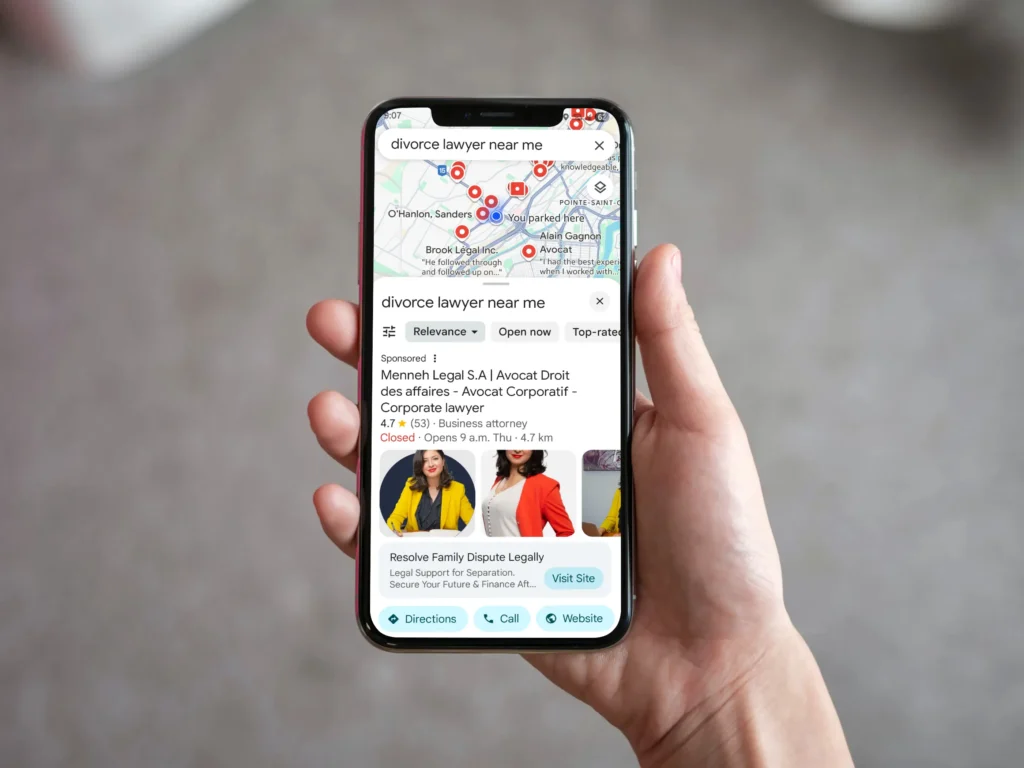 hand holding phone searching for divorce lawyer in google maps